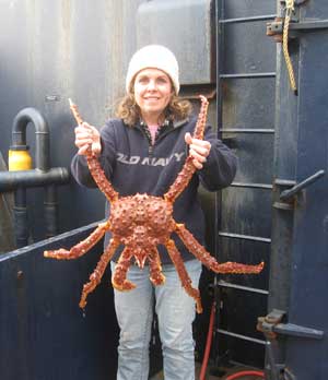 Dr. Norman holding a king crab
